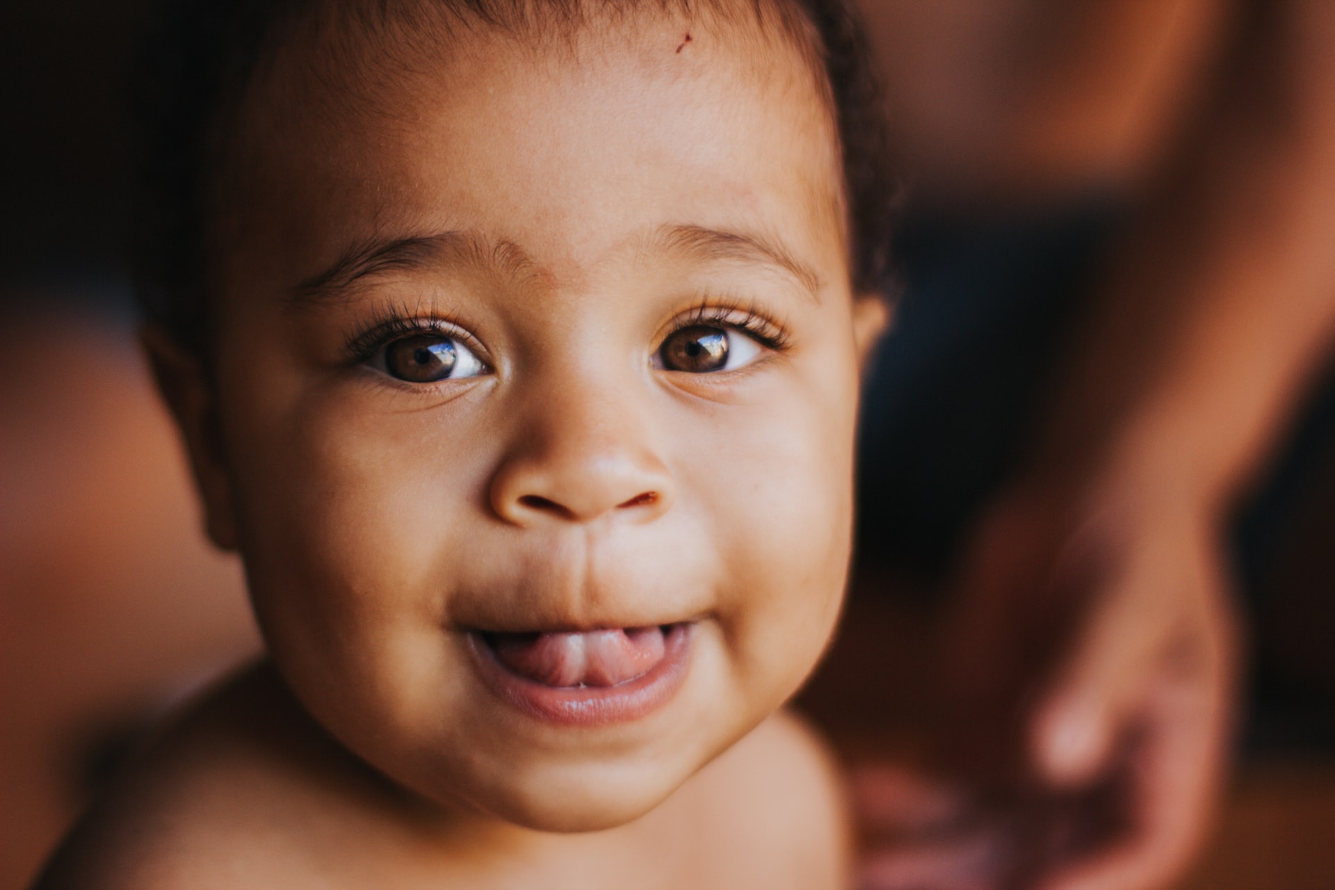 Happy baby with first tooth